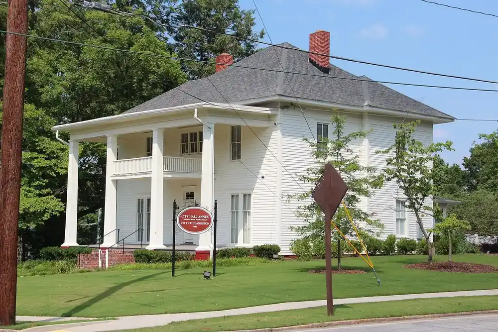Clarkston City Annex, a white two-story house with a columned porch, in Clarkston, Georgia